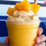 Fruit Smoothie with Orange Juice: A Refreshing Way to Boost Your Day 4 Fruit smoothie with orange juice topped with orange slices and berries.