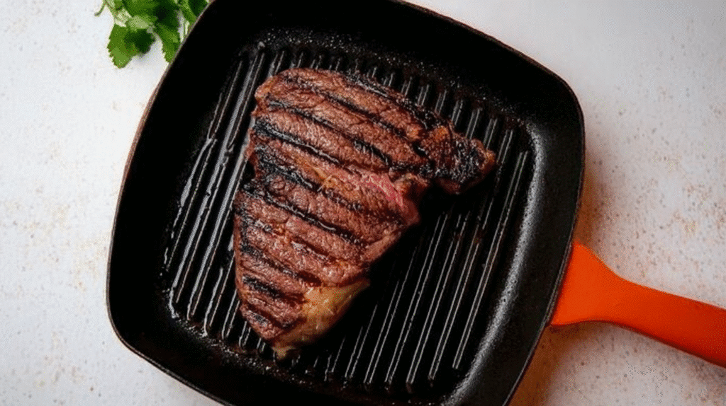 Denver Steak 6 Pan-searing Denver steak in a cast-iron skillet with butter and herbs