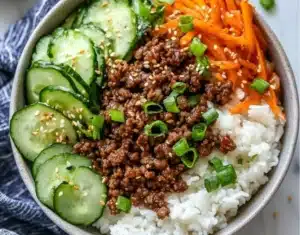 Delicious Korean Ground Beef Bowl garnished with vegetables and sesame seeds.