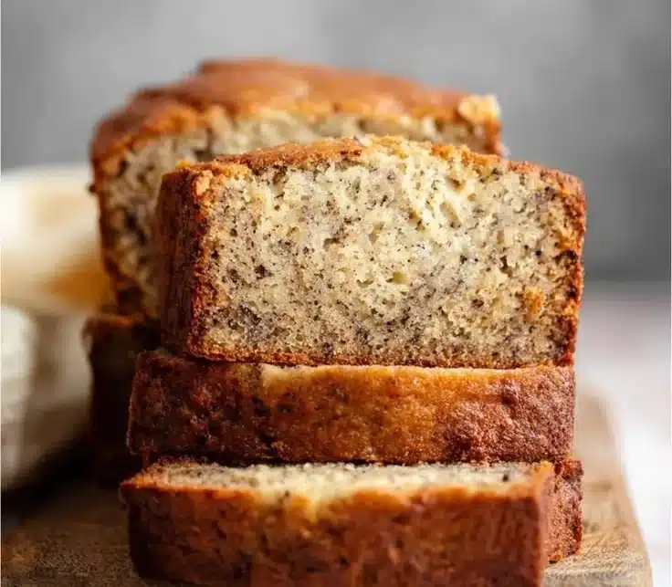 Delicious homemade banana bread served on a wooden cutting board.