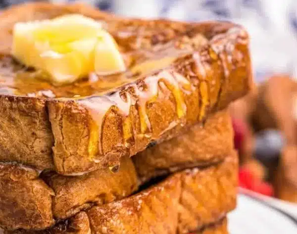 Grill Fresh Eats 4 Delicious Blackstone French Toast served with syrup and berries.