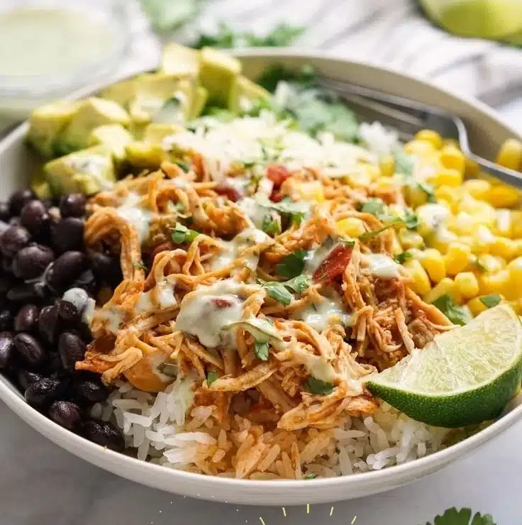 Delicious Chicken Burrito Bowl with chicken, rice, beans, and fresh toppings.