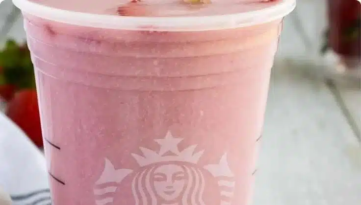 Copycat Pink Drink 3 Homemade Copycat Pink Drink with fruits and cream in a glass