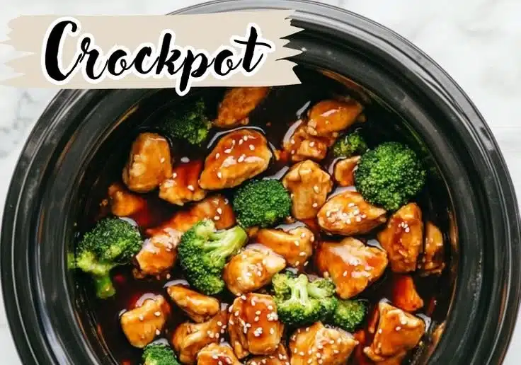 Crockpot teriyaki chicken served on a plate with rice and vegetables.