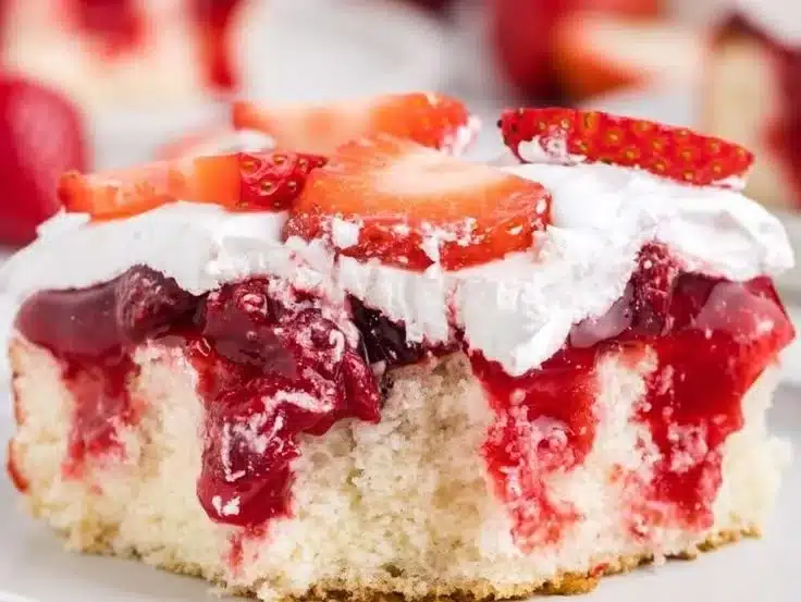 Strawberry Shortcake Poke Cake 3 Strawberry Shortcake Poke Cake topped with fresh strawberries and whipped cream