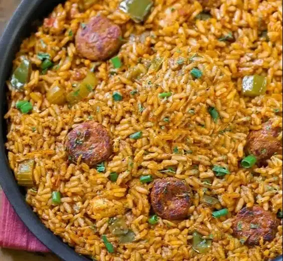 Delicious plate of Authentic New Orleans Creole Jambalaya garnished with herbs