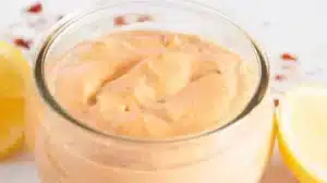 Homemade Cajun Aioli served in a bowl with fresh herbs and spices