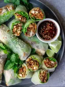 Crispy Chicken Spring Rolls served with a dipping sauce
