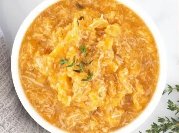 Chicken puree with sweet potato and thyme in a bowl