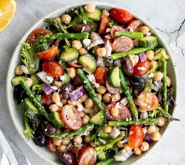 Chopped Asparagus Salad 3 Fresh chopped asparagus salad with colorful vegetables and dressing