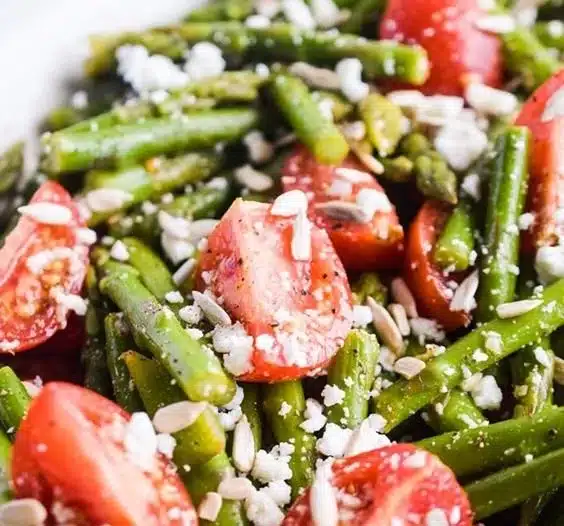 Fresh asparagus tomato feta salad with vibrant colors and healthy ingredients.