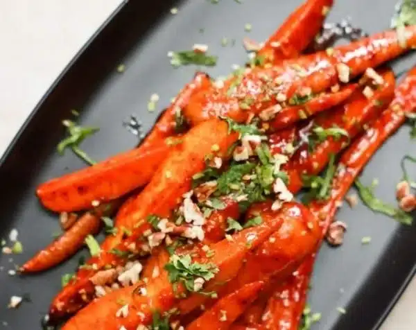Gochujang Oven Roasted Carrots 3 Oven roasted carrots with gochujang sauce garnished with herbs