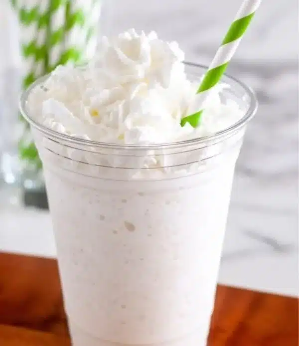 Homemade vanilla bean frappuccino topped with whipped cream and vanilla bean sprinkles