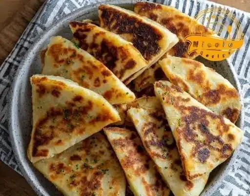 Irish Potato Farls 3 Homemade Irish potato farls served with butter and herbs