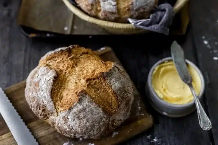 Freshly baked Traditional Irish Soda Bread on a wooden table