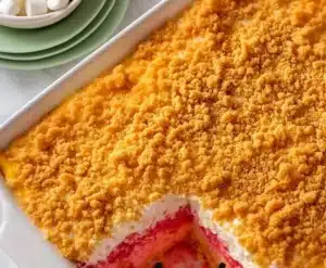 Creamy no bake rhubarb bars topped with whipped cream and fresh rhubarb