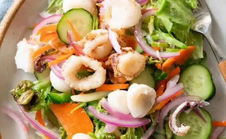 Garden Salad with Calamari 4 Fresh garden salad topped with crispy calamari and vibrant vegetables