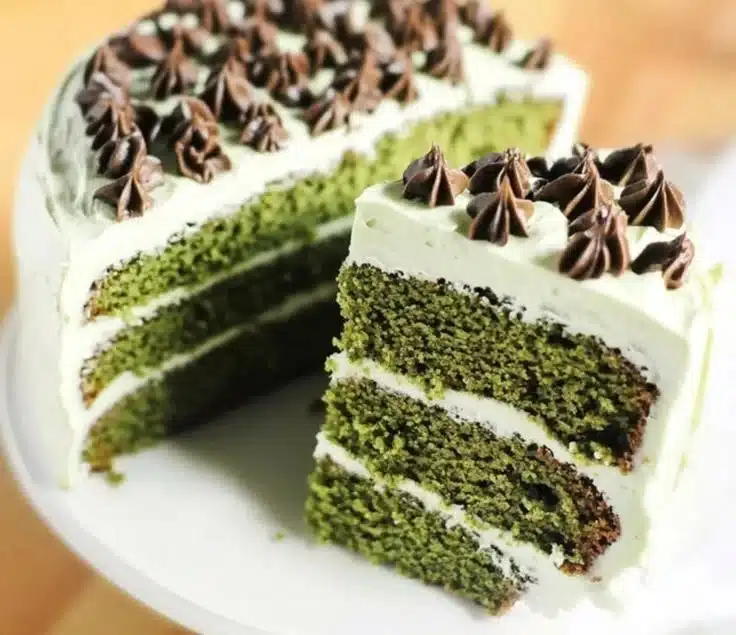 Green Velvet Cake 3 A beautifully decorated Green Velvet Cake with cream cheese frosting and sprinkles.