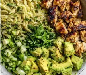 Healthy Grilled Chicken Orzo Salad with Avocado on a plate