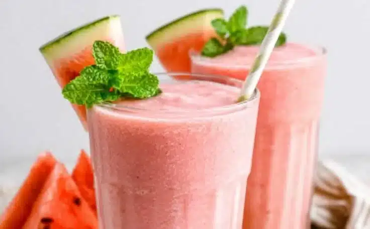Refreshing watermelon smoothie in a glass garnished with mint leaves