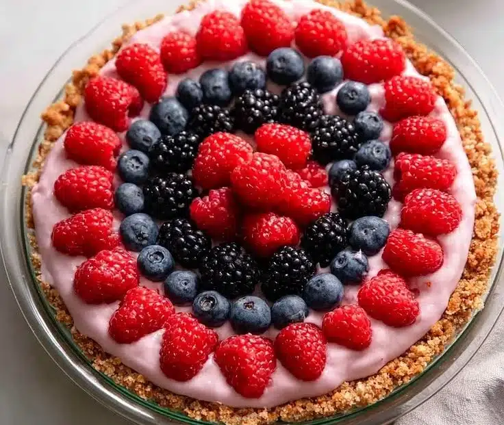Grill Fresh Eats 5 Berry Fruit Pizza with Oatmeal Cookie Crust topped with fresh berries and cream