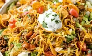 Delicious Frito Taco Salad served in a colorful bowl with fresh toppings