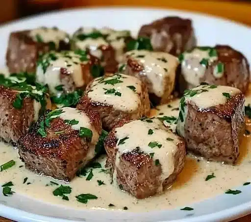 Delicious garlic butter steak bites served on a plate.