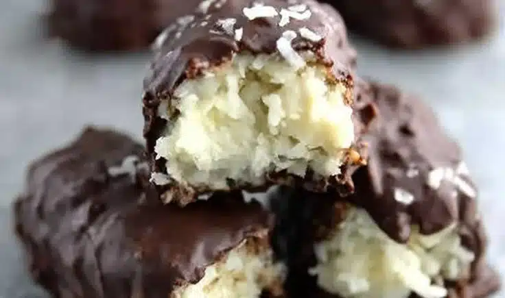 Three Ingredient Mounds Bars 4 Homemade three ingredient Mounds Bars with coconut and chocolate coating.