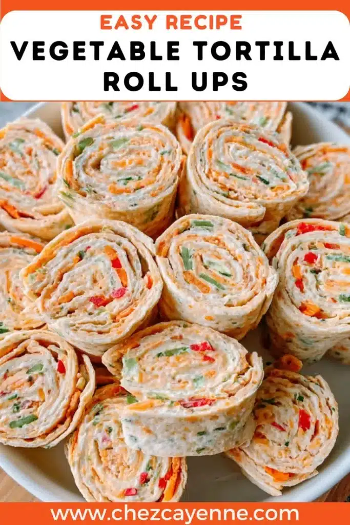 Plate of colorful Vegetable Tortilla Roll Ups with fresh veggies and tortillas.
