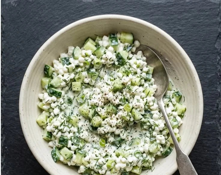 Cucumber Cottage Cheese Salad 2 Cucumber salad with cottage cheese served in a bowl, fresh and healthy dish.