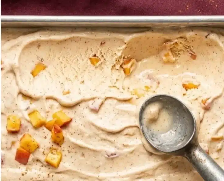 Healthy Peach Ice Cream 2 Healthy peach ice cream in a bowl with fresh peaches