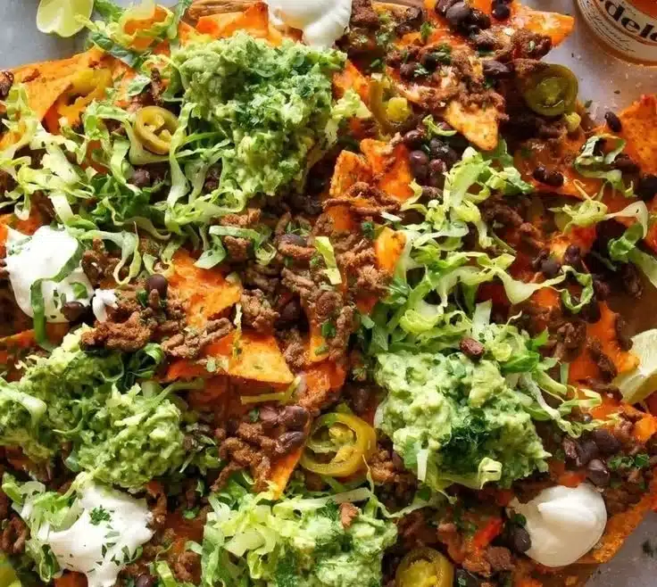 Delicious Chipotle Chicken Nachos with jalapeno yogurt topping