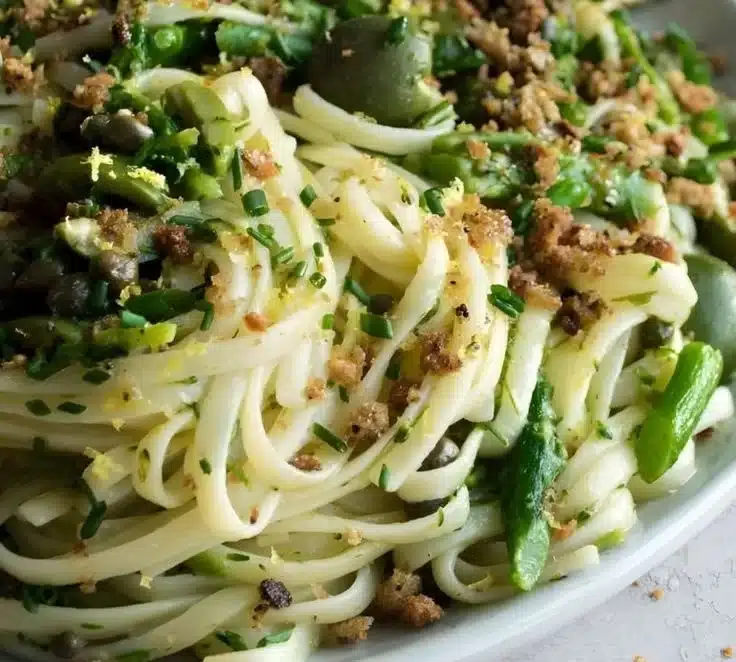 Delicious fresh green olive linguine served with a sprinkle of parmesan cheese