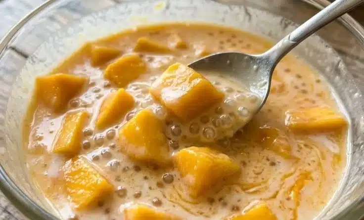 Delicious bowl of Mango Sago topped with fresh mango and coconut milk.