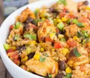 Bowl of Southwest Chicken and Rice with colorful ingredients and spices